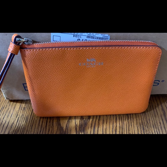 Coach Handbags - NWT Coach Orange Wristlet